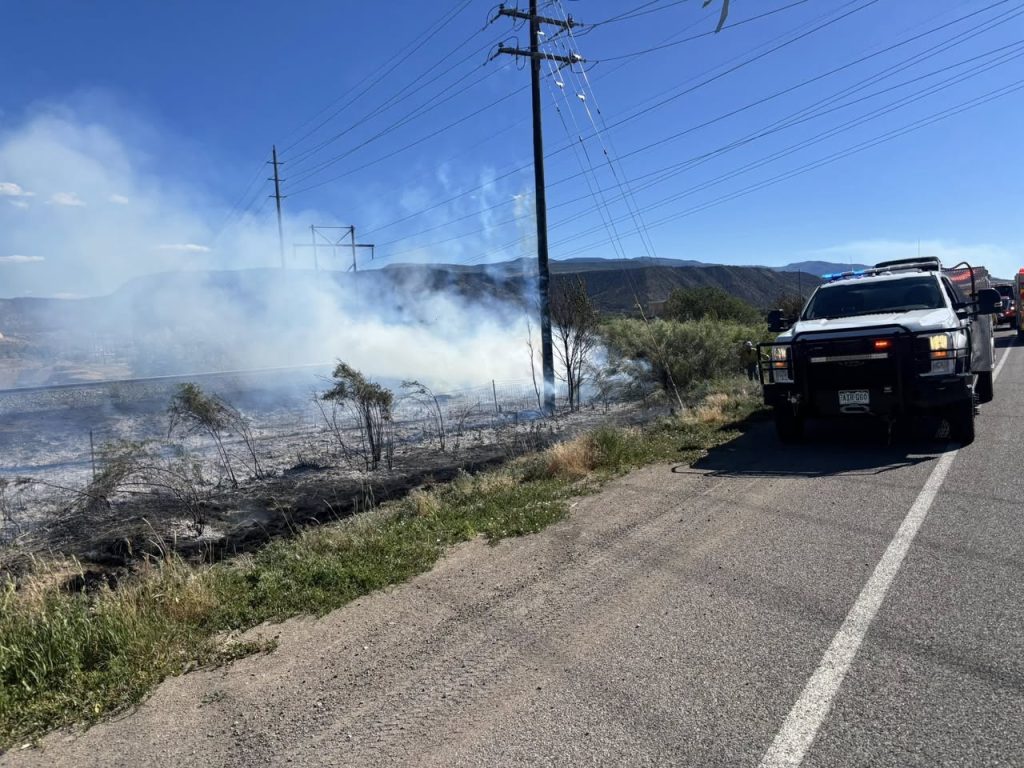 Highway 6 reopens after grass fire near Powerline Road